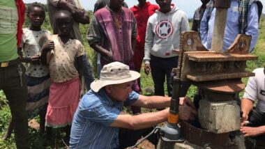 A WEFTA worker and local partners troubleshoot a groundwater well that provides water to Bachuma Hospital in West Omo Zone, Ethiopia.